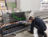 A photo of an R&J Machinery engineer repairing a machine